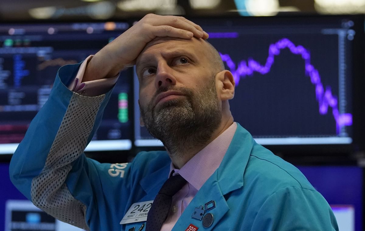 Meric Greenbaum, Designated Market Maker IMC financial looks up at the board before the opening bell right before trading halted on the New York Stock Exchange on in New York. (AFP Photo)