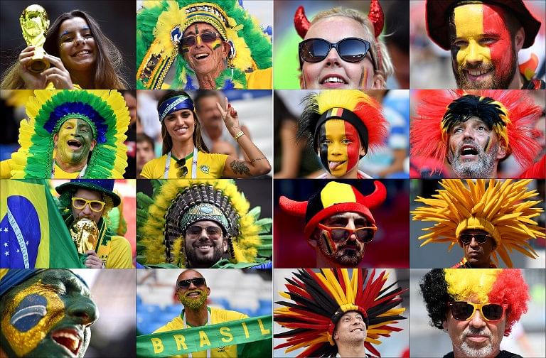These photos show fans of Brazil (L) and Belgium supporting their team during the Russia 2018 World Cup football tournament. Brazil will face Belgium in their Russia 2018 World Cup quarter-final football match at the Kazan Arena in Kazan on July 6, 2018. Credit: AFP