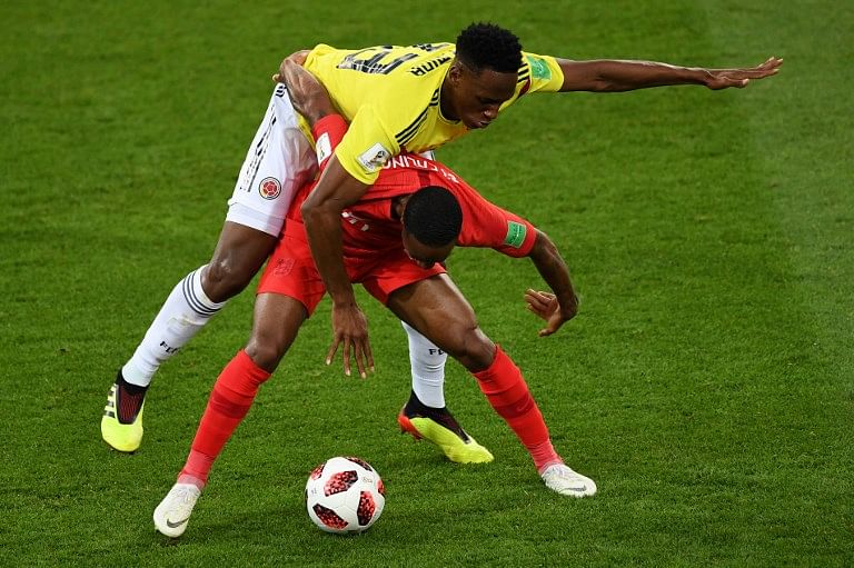 Colombia's defender Yerry Mina (L) vies with England's forward Raheem Sterling during the Russia 2018 World Cup round of 16 football match between Colombia and England at the Spartak Stadium in Moscow on July 3, 2018.  Francisco LEONG / AFP