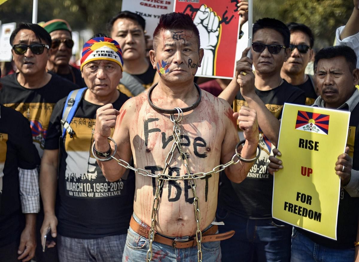 New Delhi: A Tibetan national in a demonstration protest to mark the 60th anniversary of their National Uprising Day, in New Delhi, Sunday, March 10, 2019. (PTI Photo/Ravi Choudhary)