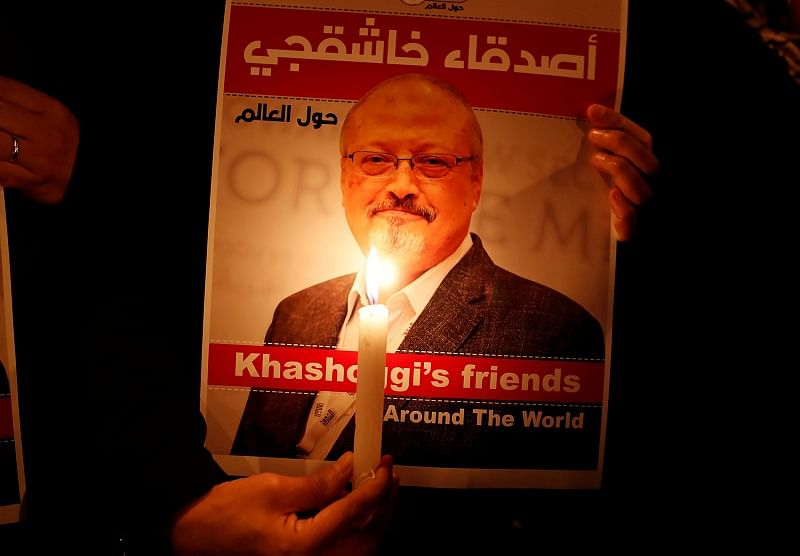 A demonstrator holds a poster with a picture of Saudi journalist Jamal Khashoggi outside the Saudi Arabia consulate in Istanbul. (Reuters)