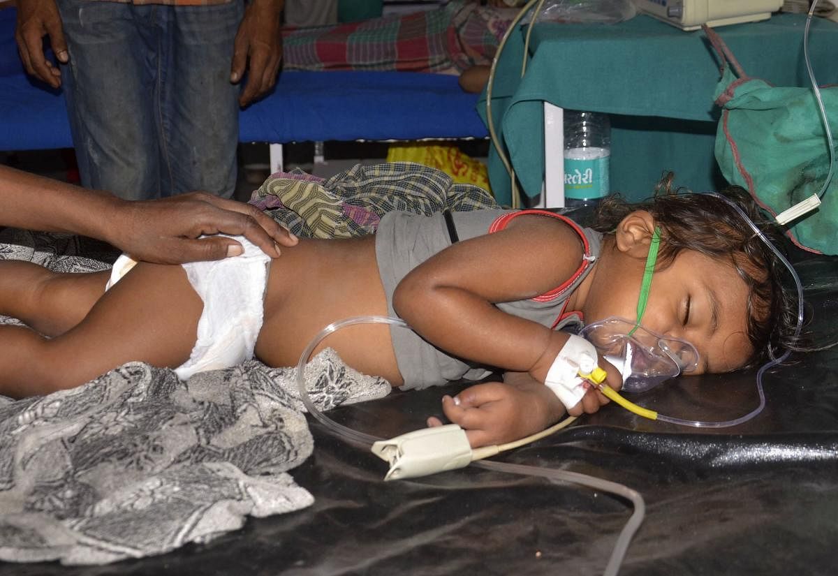 A child shows symptoms of Acute Encephalitis Syndrome (AES) undergoes treatment at a hospital, in Muzaffarpur, Monday, June 17, 2019. The death toll rose to 100 in Muzaffarpur and the adjoining districts in Bihar. PTI