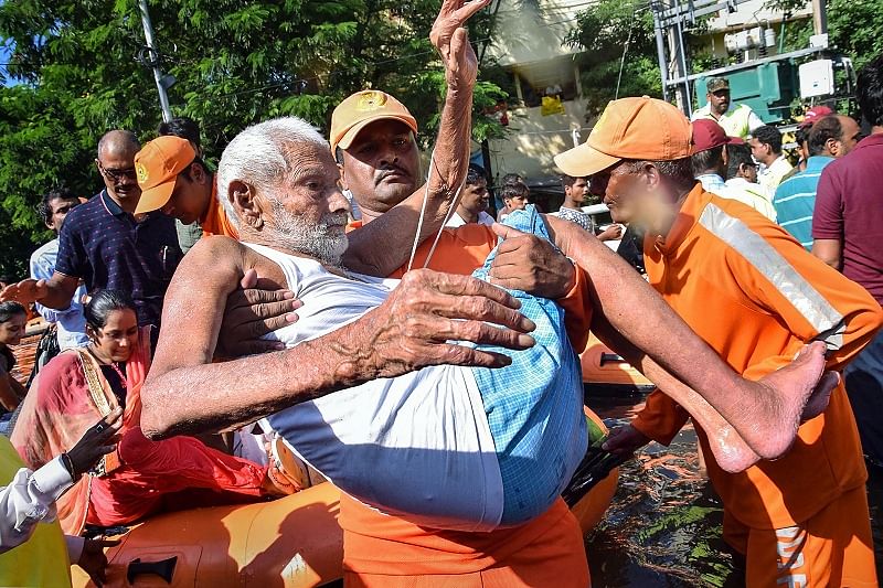 An elderly man being rescued from flood-affected Rajendra Nagar area, in Patna. (PTI)
