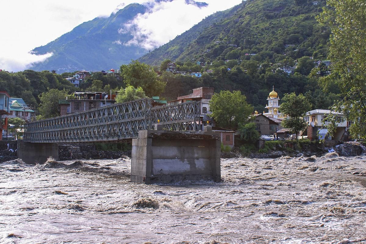 A view of a damaged bridge over the swollen Beas river following heavy monsoon rain in Kullu district, Monday, Aug 19, 2019. (PTI Photo)