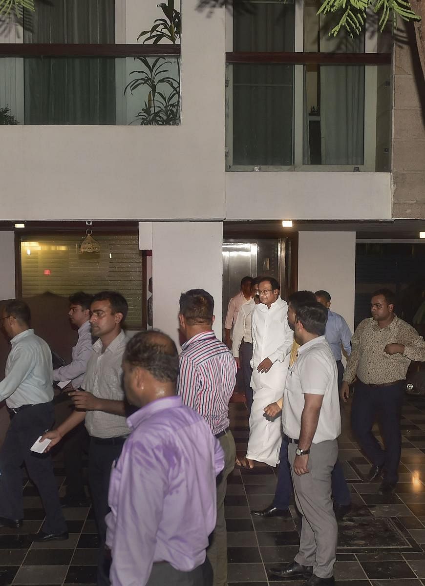 Central Bureau of Investigation (CBI) officials escort Congress leader P Chidambaram from his Jor Bagh residence in New Delhi, Wednesday, Aug 21, 2019. (PTI)