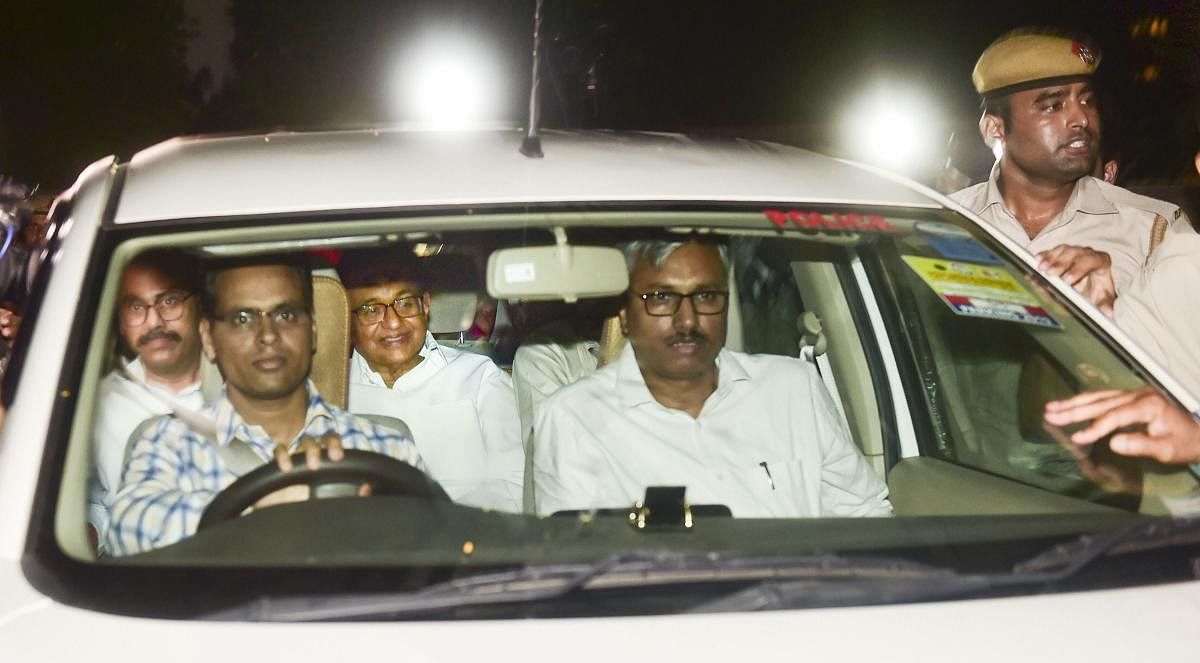 Central Bureau of Investigation (CBI) officials arrest Congress leader P Chidambaram from his Jor Bagh residence in New Delhi, Wednesday, Aug 21, 2019. (PTI Photo)