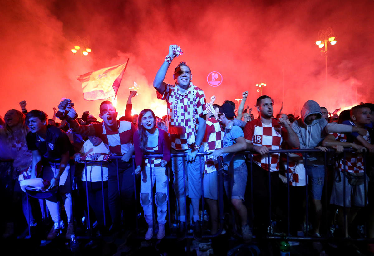 Croatian fans react after a goal as they watch the broadcast of the World Cup semi-final match between Croatia and England in the fan zone. (Reuters Photo)