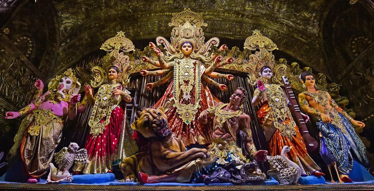 Idols of Goddess Durga and other deities installed at a community Durga Puja pandal, in Kolkata. (PTI photo)