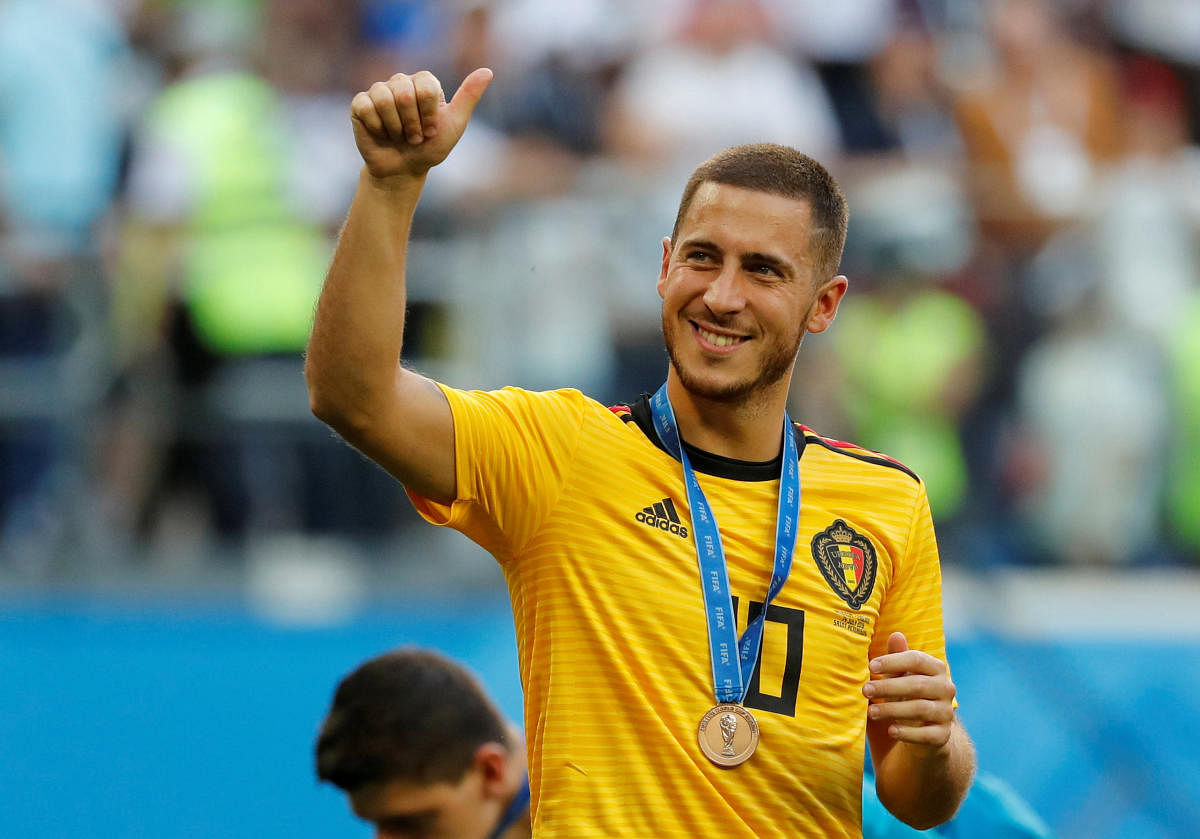 Belgium's Eden Hazard celebrates with a medal after the match. Reuters  Photo
