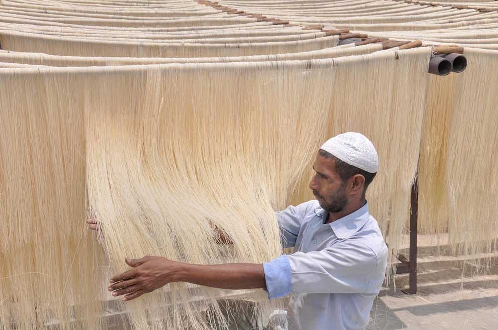 A worker makes vermicelli at a factory, ahead of Eid-ul-Fitr, in Moradabad on Sunday, June 03, 2018. PTI Photo