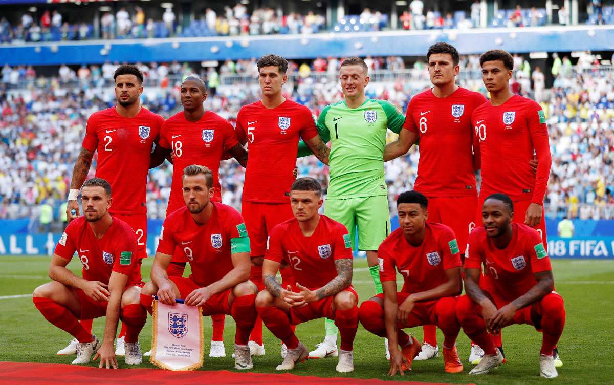 England players pose for a team group photo before the match. Reuters photo