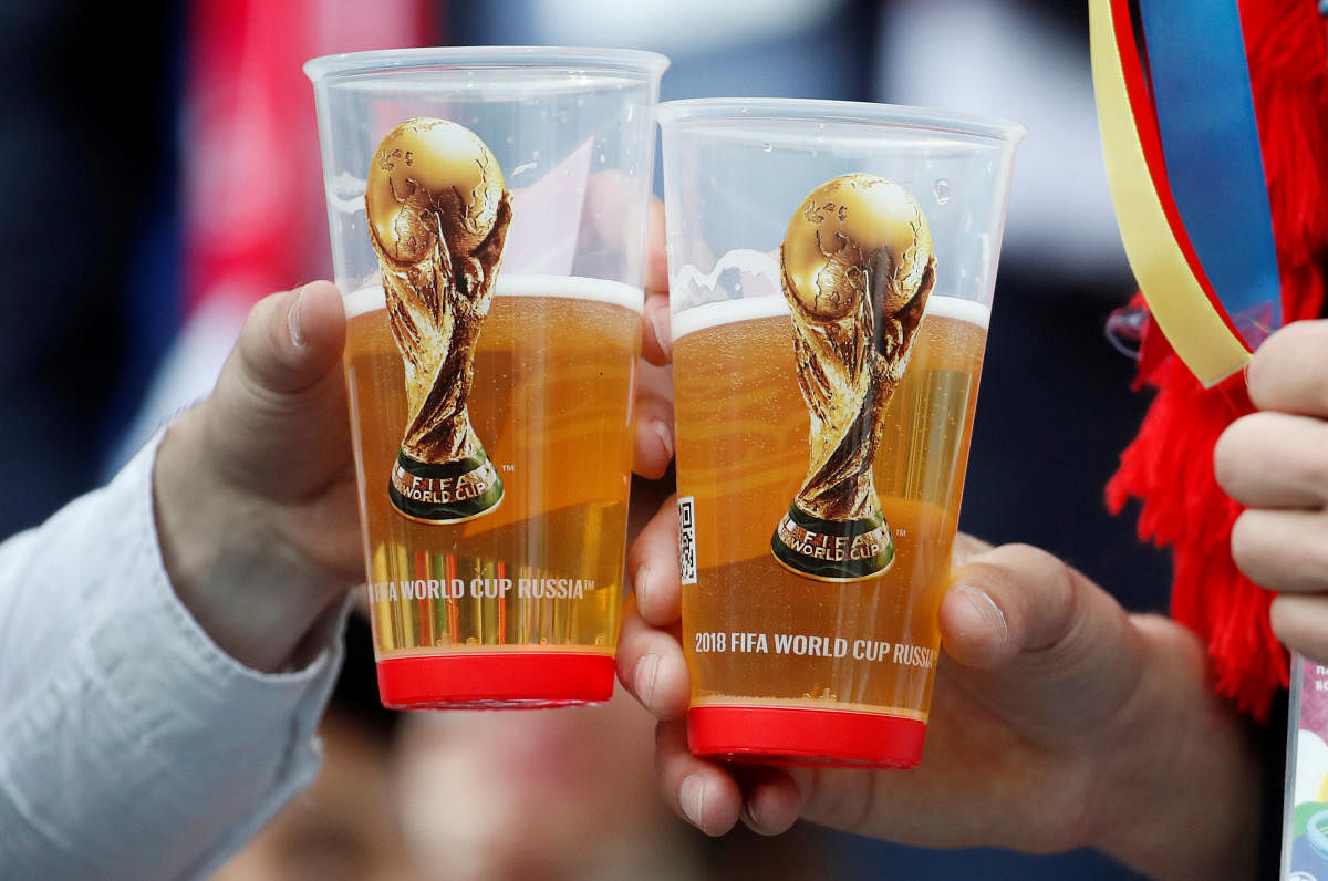 World Cup - Group A - Russia vs Saudi Arabia : Fans holding their drinks before the match in Luzhniki Stadium, Moscow, Russia.REUTERS