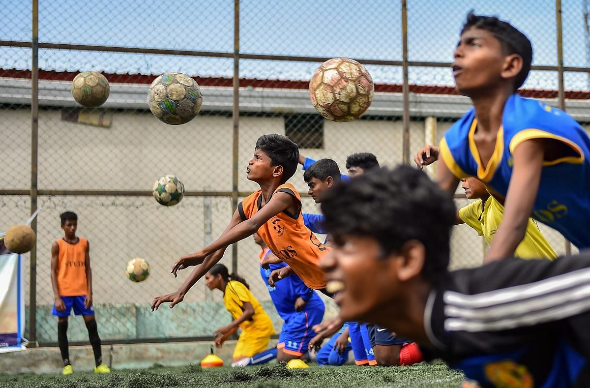 Aspiring football players at a practice session in Chennai on Tuesday. PTI Photo