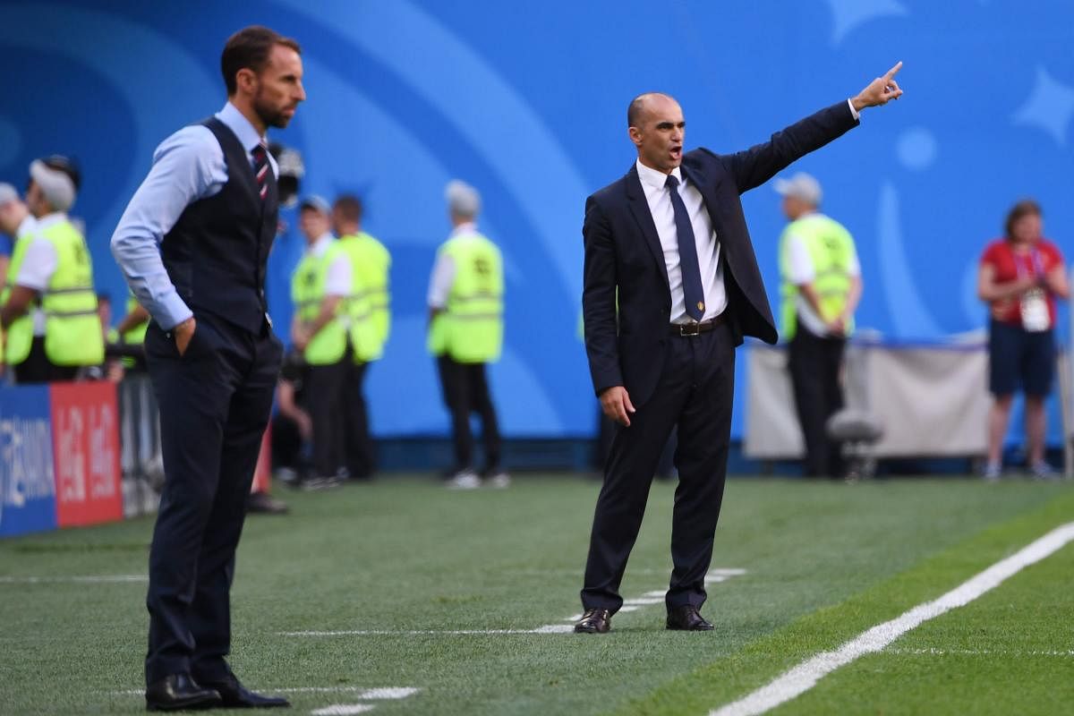 Belgium's coach Roberto Martinez gestures beside England's coach Gareth Southgate (L) during their Russia 2018 World Cup play-off for third place football match between Belgium and England at the Saint Petersburg Stadium in Saint Petersburg. AFP  Photo