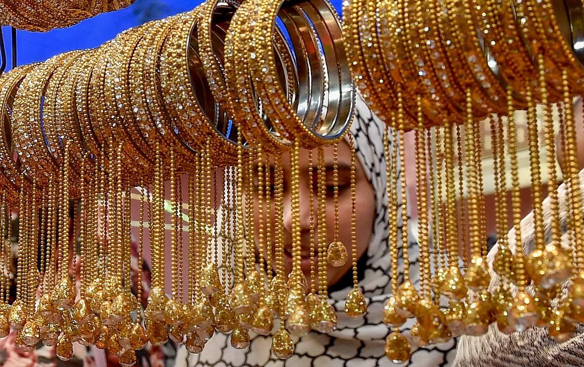 Muslim woman buys ornaments ahead of Eid al-Fitr, in Kolkata on Wednesday. PTI Photo