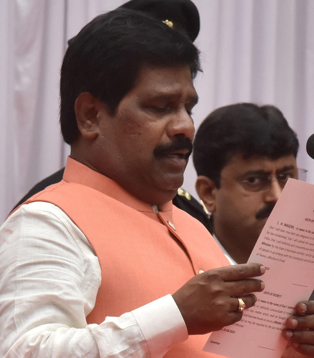 H Nagesh takes oath as a minister