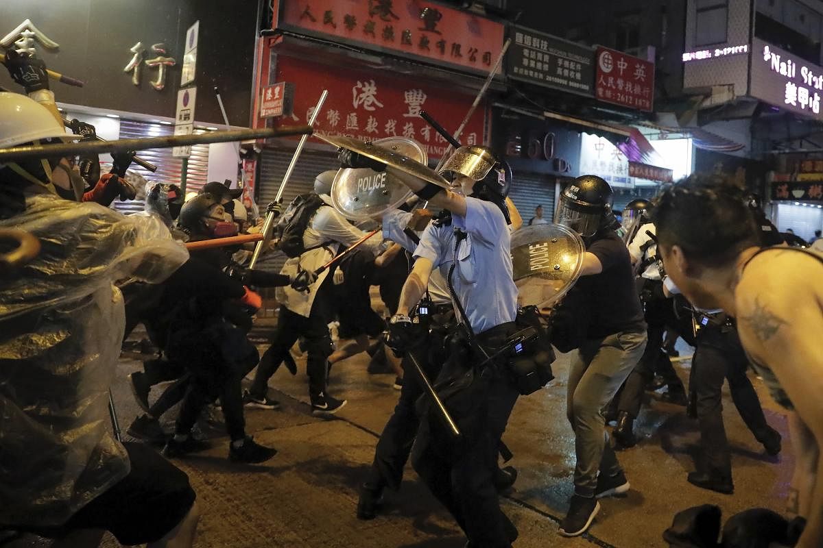 Policemen clash with demonstrators on a street during a protest in Hong Kong, Sunday, Aug. 25, 2019. (AP/PTI)