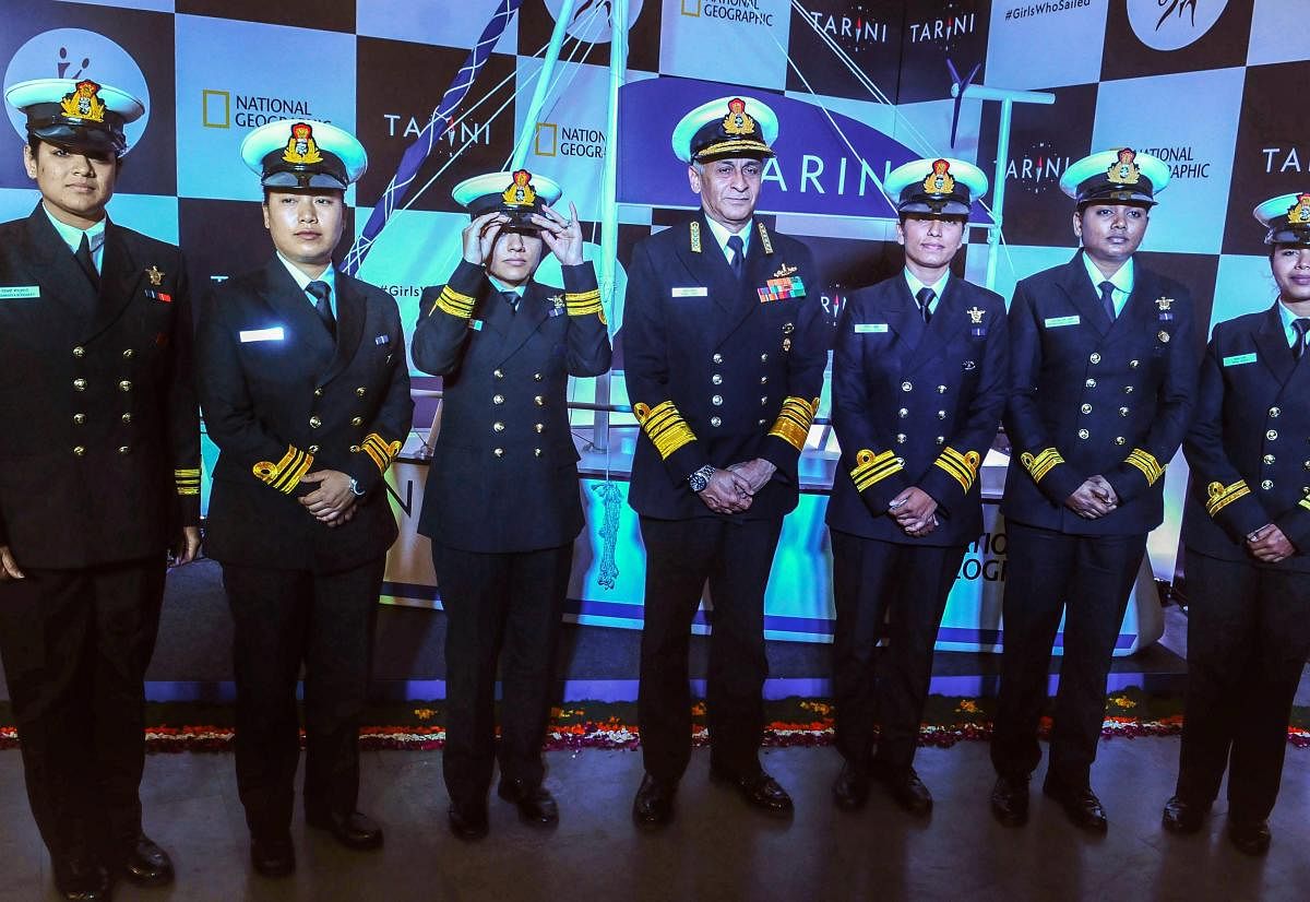 Chief of Naval Staff Admiral Sunil Lanba with the members of the all-women crew, who circumnavigated the globe onboard INS Tarini, during International Women's Day celebrations at a college in New Delhi. PTI