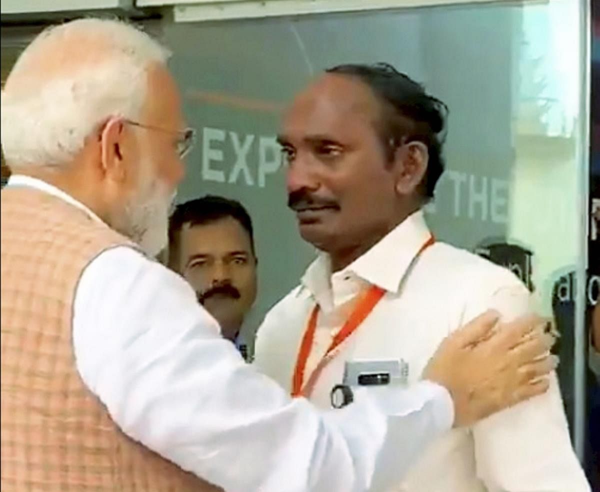 Prime Minister Narendra Modi consoles ISRO Chairman Kailasavadivoo Sivan as he got emotional after the Vikram lander connection was lost during soft landing of Chandrayaan 2 on lunar surface, in Bengaluru, Saturday, Sept. 7, 2019. (PTI Photo)