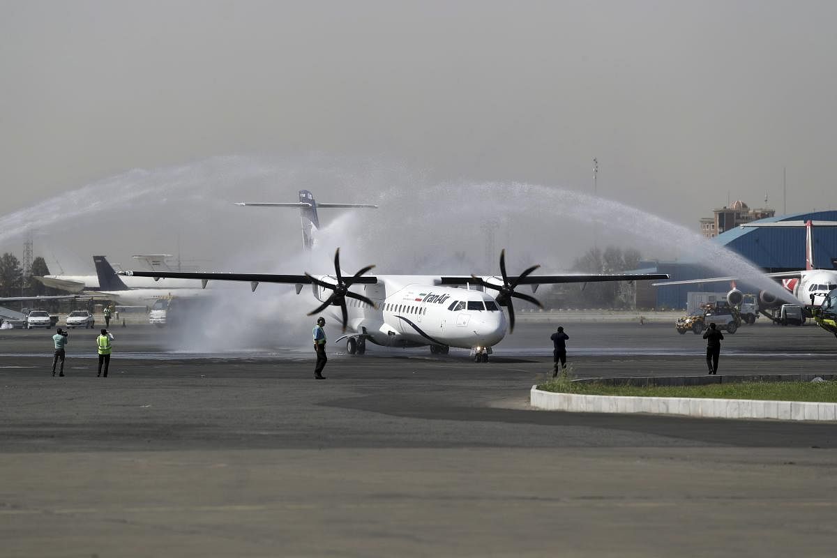 In this photo provided by Tasnim News Agency, a traditional water cannon salute welcomes an Iran Air's new commercial aircraft at Mehrabad airport in Tehran, Iran. AP/PTI photo
