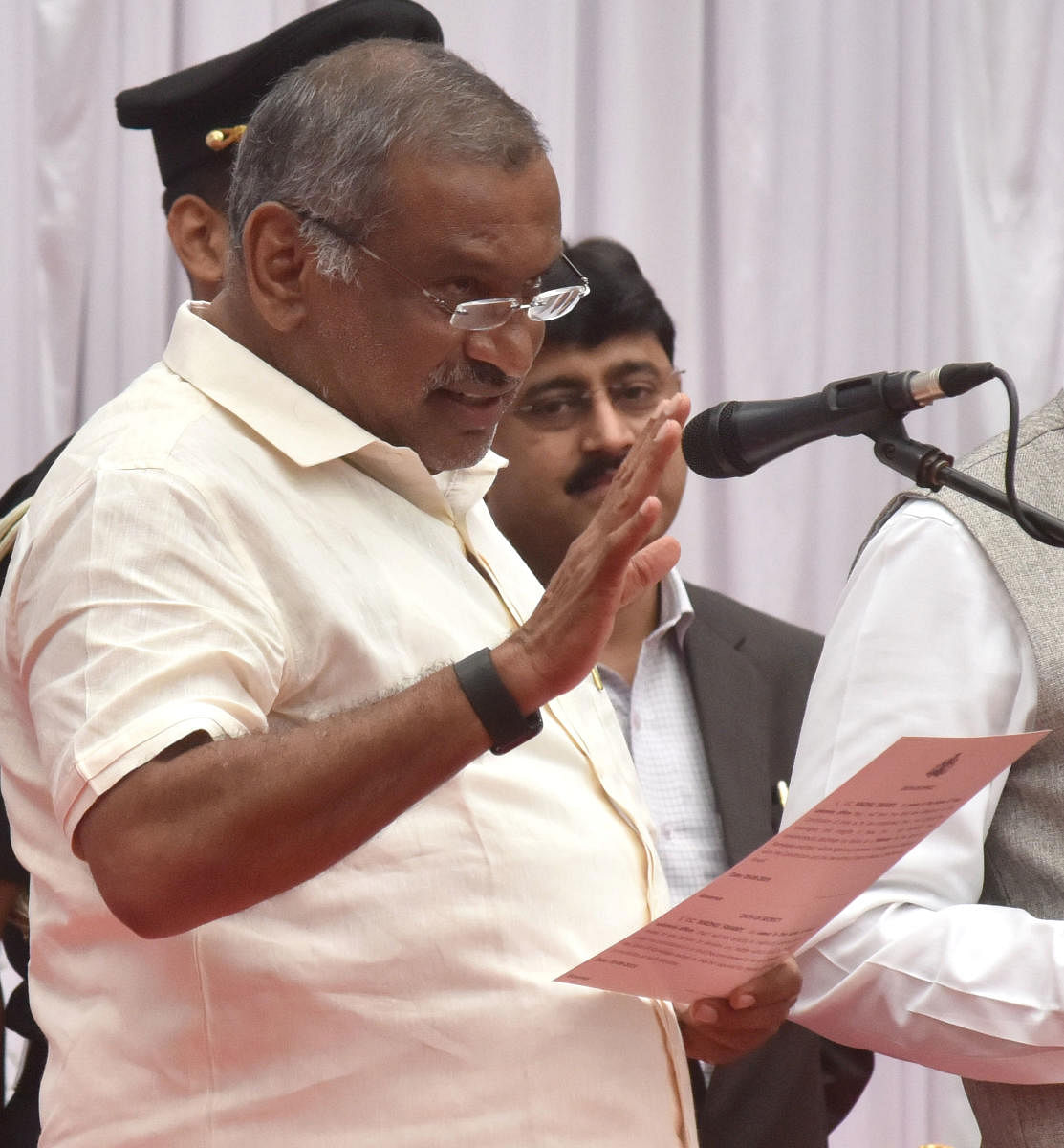 J C Madhu Swamy takes oath as a minister