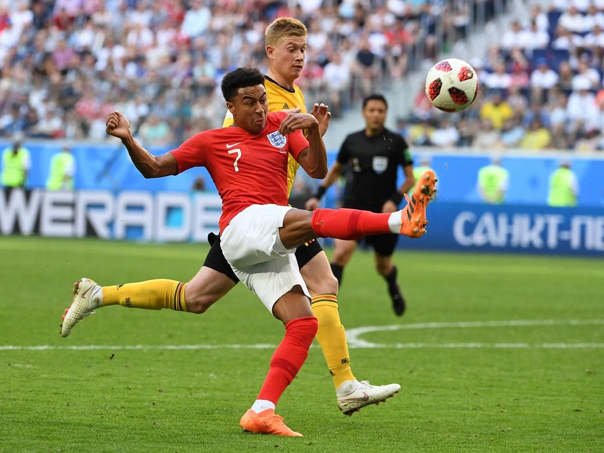 England's midfielder Jesse Lingard (L) fights for the ball with Belgium's midfielder Kevin De Bruyne during their Russia 2018 World Cup play-off for third place football match between Belgium and England at the Saint Petersburg Stadium in Saint Petersburg. AFP Photo