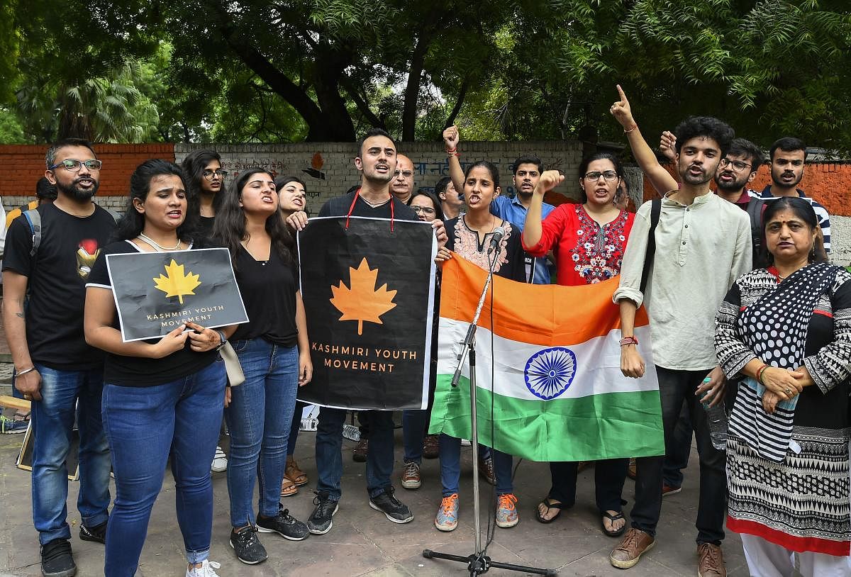 Activists of Kashmiri Youth Movement raise slogans during a protest in solidarity with Kashmir, in New Delhi, Sunday, Aug 18, 2019. (PTI Photo)