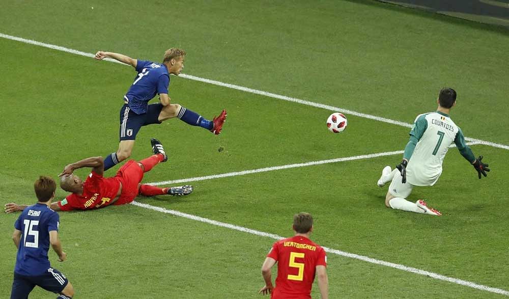 Japan's Keisuke Honda, top left, tries to score during the round of 16 match between Belgium and Japan at the 2018 soccer World Cup in the Rostov Arena. AP/PTI Photo