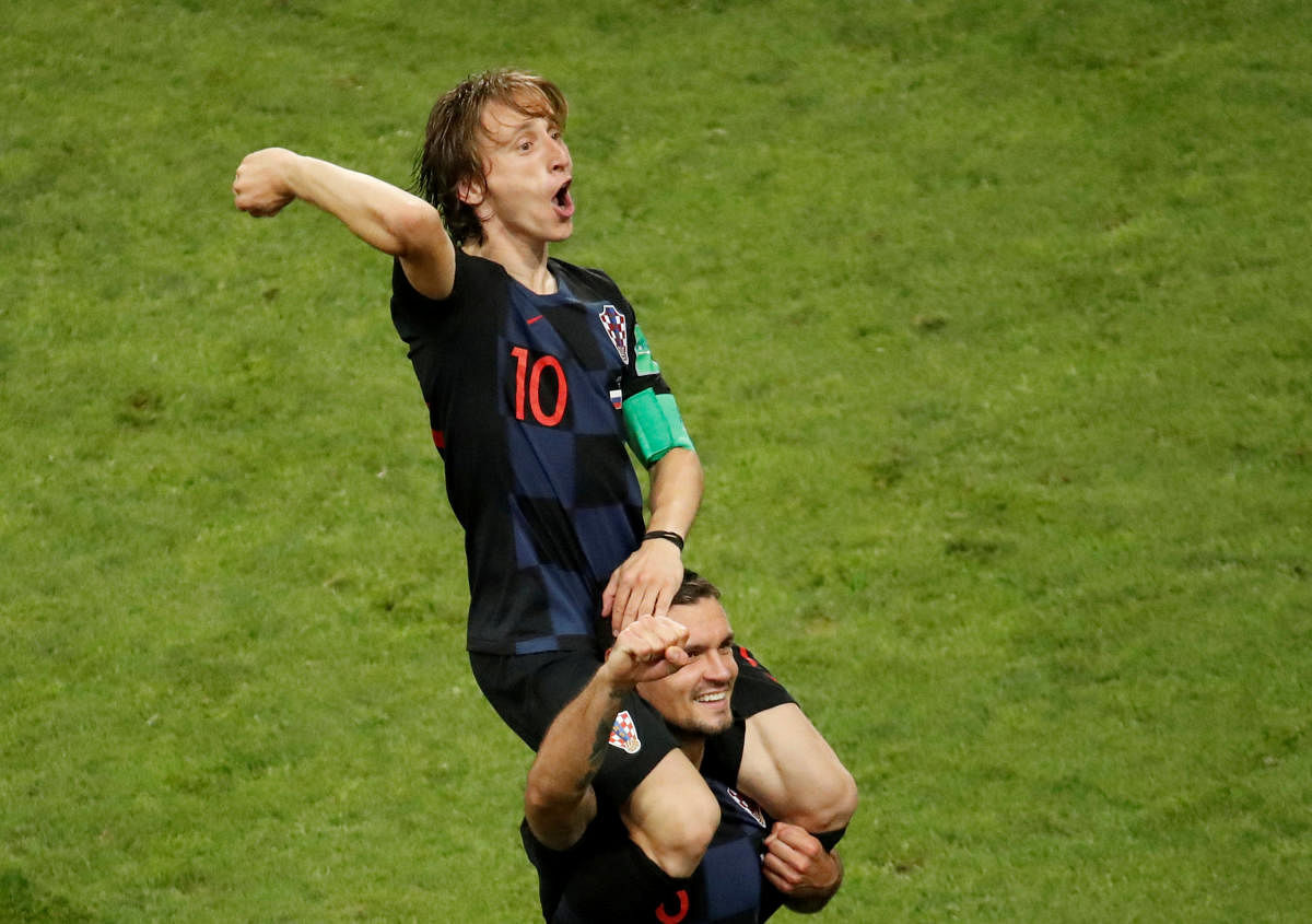 Croatia's Luka Modric and Dejan Lovren celebrate winning the penalty shootout. REUTERS