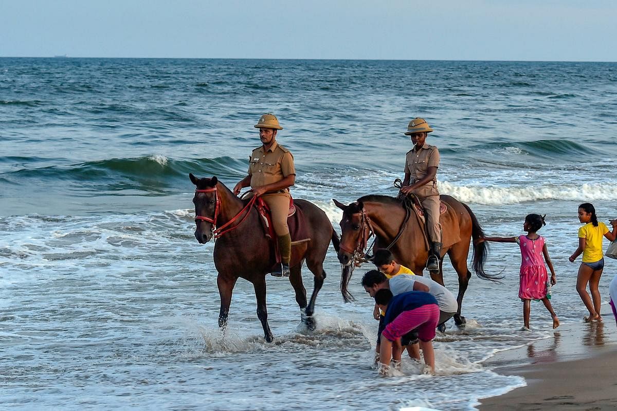 Mounted police patrol the Marina Beach in Chennai. (PTI photo)