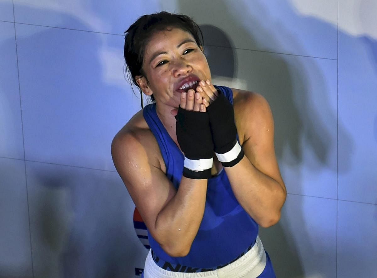 India's Mary Kom reacts after defeating Aigerim Kassenayeva of Kazakhstan in the women's light flyweight 48 kg category bout to enter quarterfinals at AIBA Women's World Boxing Championshipos, in New Delhi. PTI photo