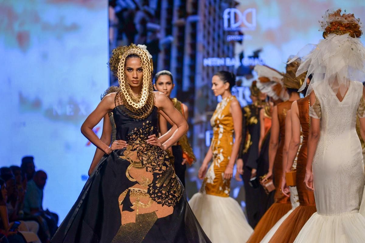 A model presents a creation by designer Nitin Bal Chauhan at India Fashion Week, in New Delhi on Thursday. (PTI photo)