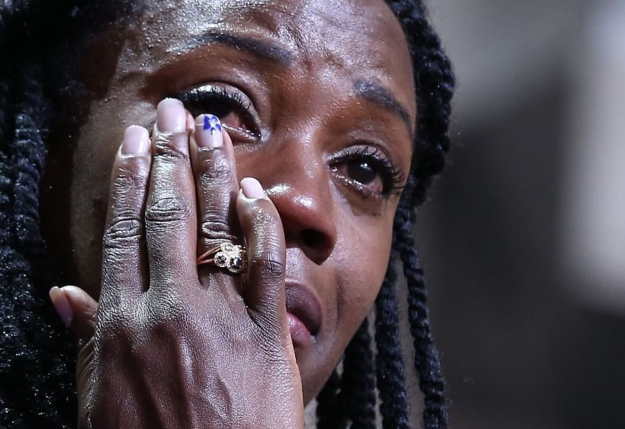 New bronze medallist USA's Alysia Johnson-Montano cries on the podium during the medal ceremony for the Women's 800m of the 2013 IAAF World Athletics Championships in Moscow. (AFP)