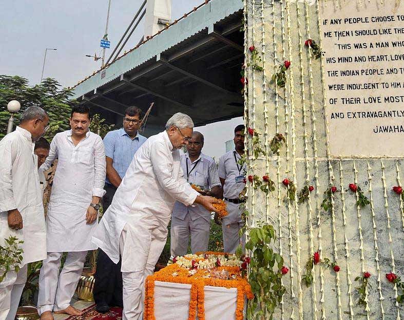 Bihar Chief Minister Nitish Kumar pays tribute to India's first prime minister Pandit Jawaharlal Nehru on his 54th death anniversary, in Patna, on Sunday. PTI Photo