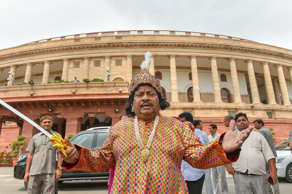 New Delhi: Telugu Desam Party (TDP) MP Naramalli Sivaprasad protests for the special status to the state of Andhra Pradesh, during the Monsoon session of Parliament, in New Delhi on Monday, July 30, 2018. (PTI Photo/ Kamal Kishore)
