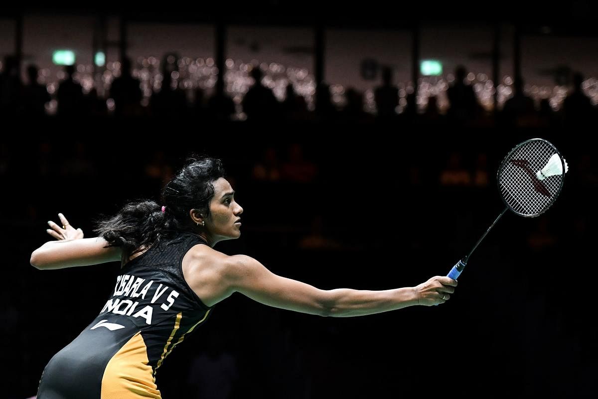India's PV Sindhu returns the shuttlecock to Taiwan's Tai Tzu-ying during theirr women's single quarter-final match at the BWF Badminton World Championships at the St. Jakobshalle in Basel on August 23, 2019. (FABRICE COFFRINI / AFP)