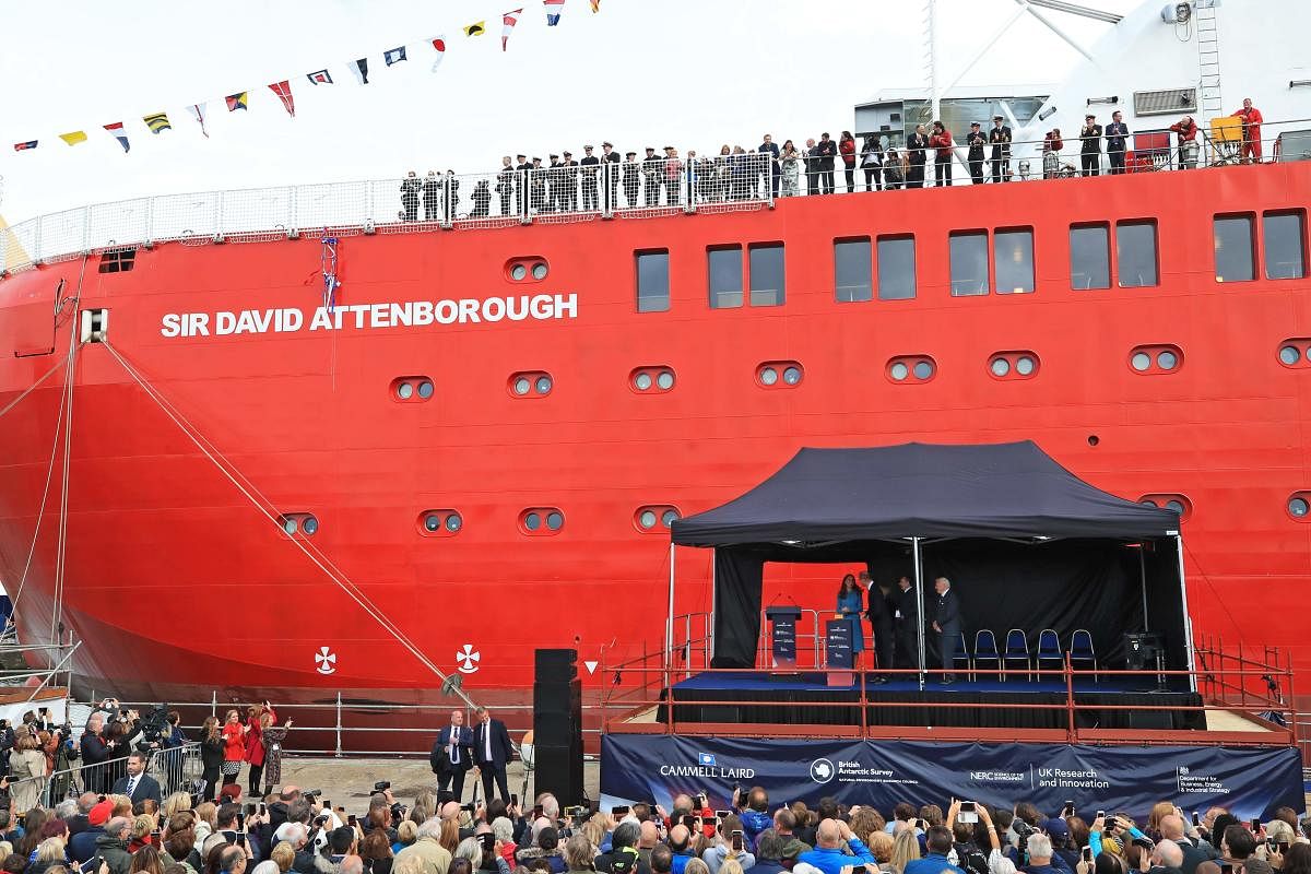 Britain's Prince William, Duke of Cambridge, Britain's Catherine, Duchess of Cambridge and Sir David Attenborough (stood on the stage) attend the naming ceremony of Britain's new polar research ship, the RRS Sir David Attenborough in Birkenhead, northwest England on September 26, 2019. (Photo by Peter Byrne / POOL / AFP)