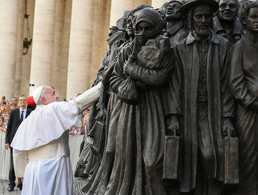 Pope Francis unveils the sculpture on the theme of refugees and migration ' Angels Unawares ' by Canadian sculptor Timothy P. Schmalz.(PTI)