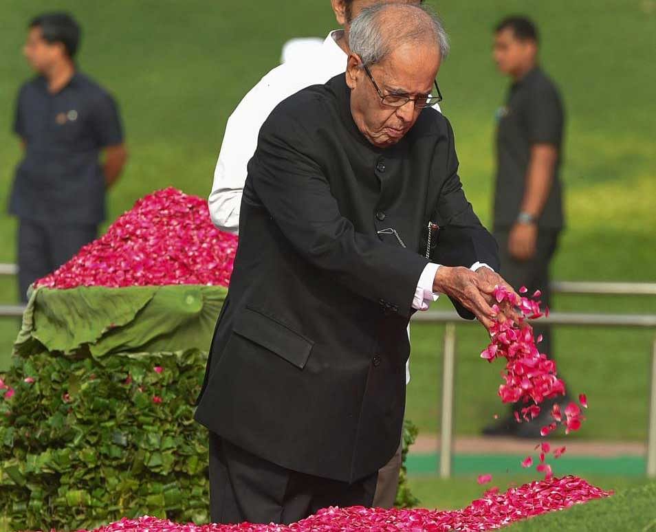 Former president Pranab Mukherjee pays tribute to India's first prime minister Pandit Jawaharlal Nehru on his 54th death anniversary, at Shanti Van, in New Delhi on Sunday.  PTI Photo