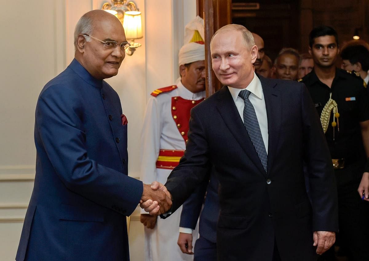President Ram Nath Kovind shakes hands with his Russian counterpart Vladimir Putin during a meeting, at Rashtrapati Bhavan in New Delhi on Friday. PTI Photo