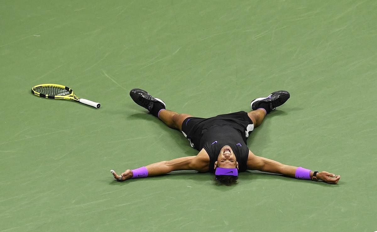 Rafael Nadal of Spain reacts after winning a point against Daniil Medvedev. (Photo by AP/PTI)