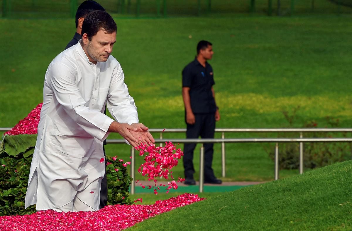 Congress President Rahul Gandhi pays tribute to India's first prime minister Pandit Jawaharlal Nehru on his 54th death anniversary, at Shanti Van, in New Delhi, on Sunday.  PTI Photo