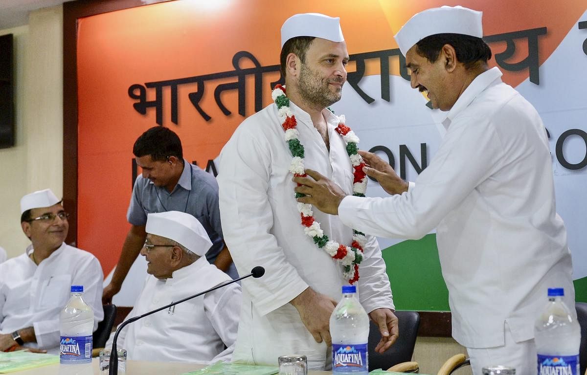 Congress President Rahul Gandhi being greeted by the the national executives of Congress Seva Dal during a meeting, at AICC Headquarter in New Delhi. PTI Photo