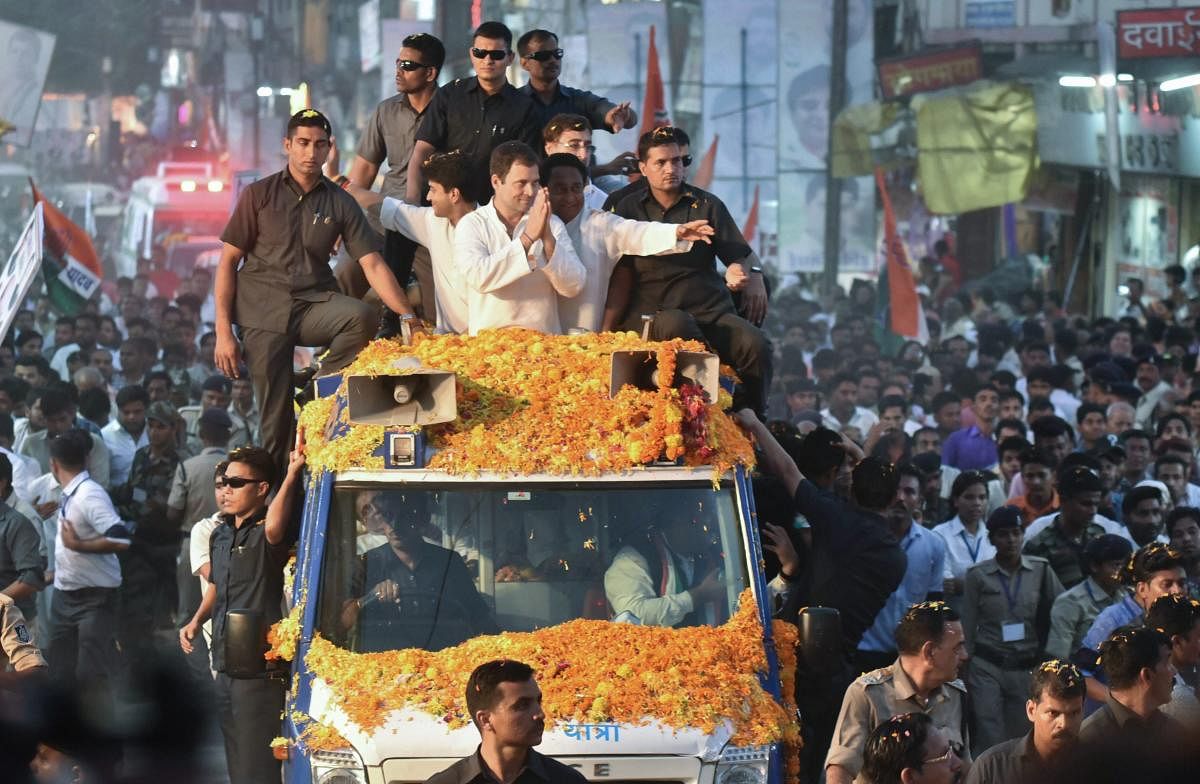 Congress President Rahul Gandhi greets his supporters during a roadshow in Jabalpur on Saturday. (PTI Photo)
