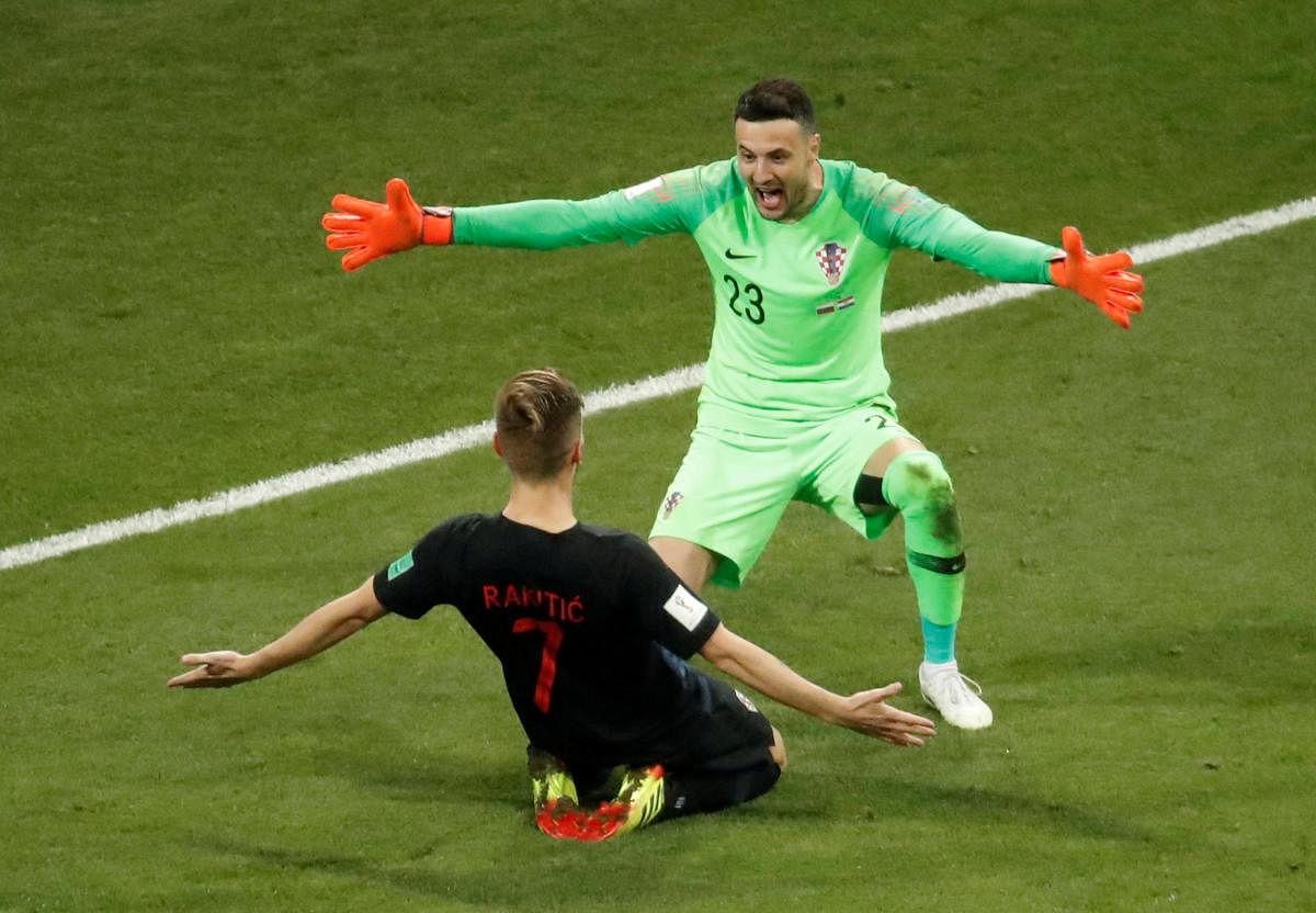 Croatia's Ivan Rakitic and Danijel Subasic celebrate winning the penalty shootout. REUTERS