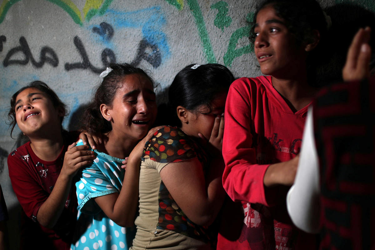 Relatives of Palestinian Alaa Ayish Hamdan, react during his funeral in the northern Gaza Strip (Photo by Reuters)