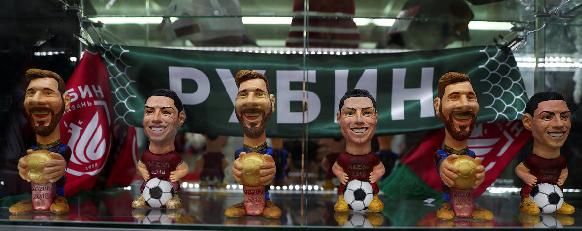 Figures depicting Argentina's star Lionel Messi and Portugal's star Cristiano Ronaldo are displayed for sale inside a souvenirs shop in Kazan, Russia, June 20, 2018. As well as shooting all the matches, Reuters photographers are producing pictures showing their own quirky view from the sidelines of the World Cup. REUTERS