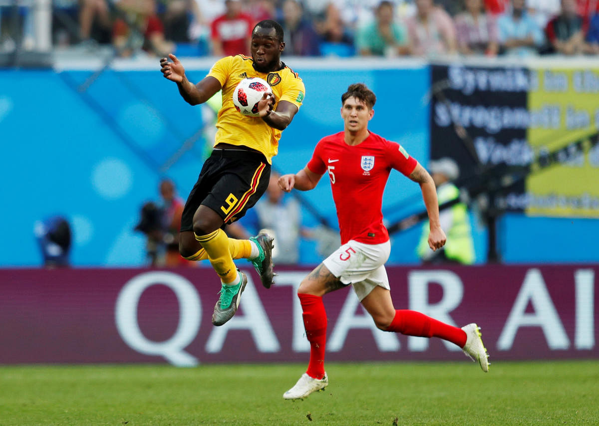 Belgium's Romelu Lukaku in action with England's John Stones. Reuters Photo