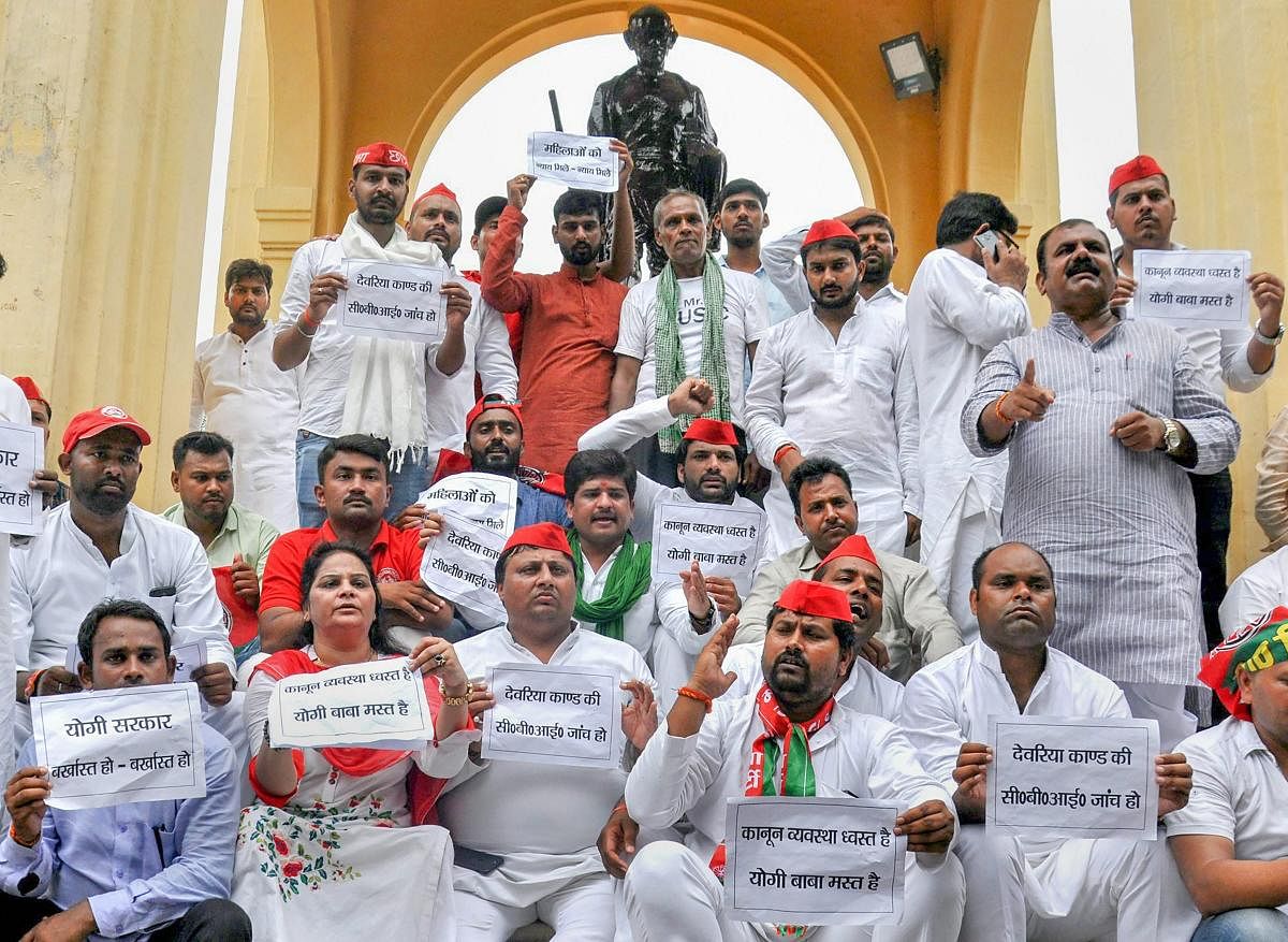 Samajwadi Party workers stage a dharna over Deoria shelter home issue, at GPO in Lucknow on Monday. PTI Photo