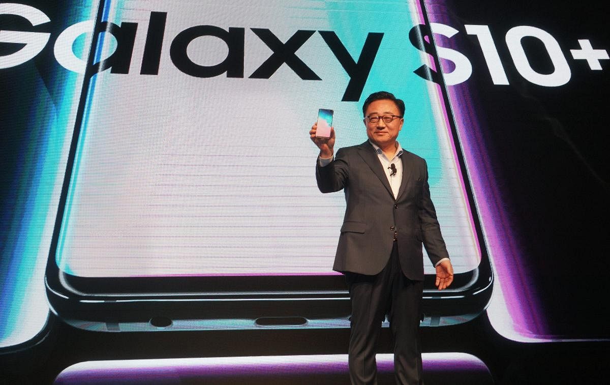 DJ Koh, president and CEO of IT & Mobile Communications Division, Samsung Electronics, launches the new Samsung Galaxy S10+ mobile phone, at a press conference in New Delhi. PTI